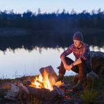 Man having campfire